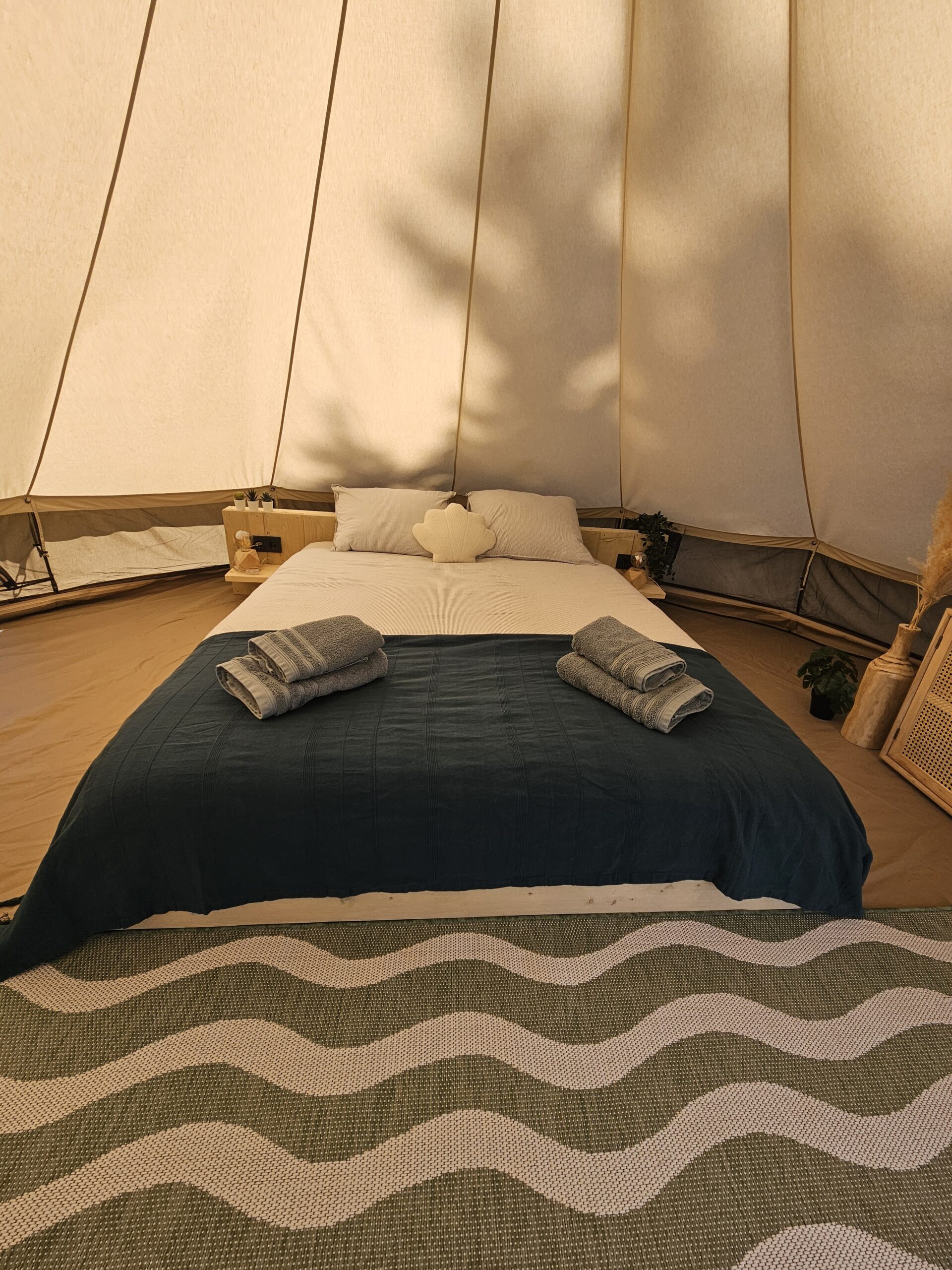 bed in beach bell tent Glamping Zeeland